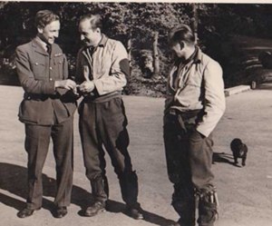 Harry Prowse talking with Rolf Pringel whilst Josef Priller  looks